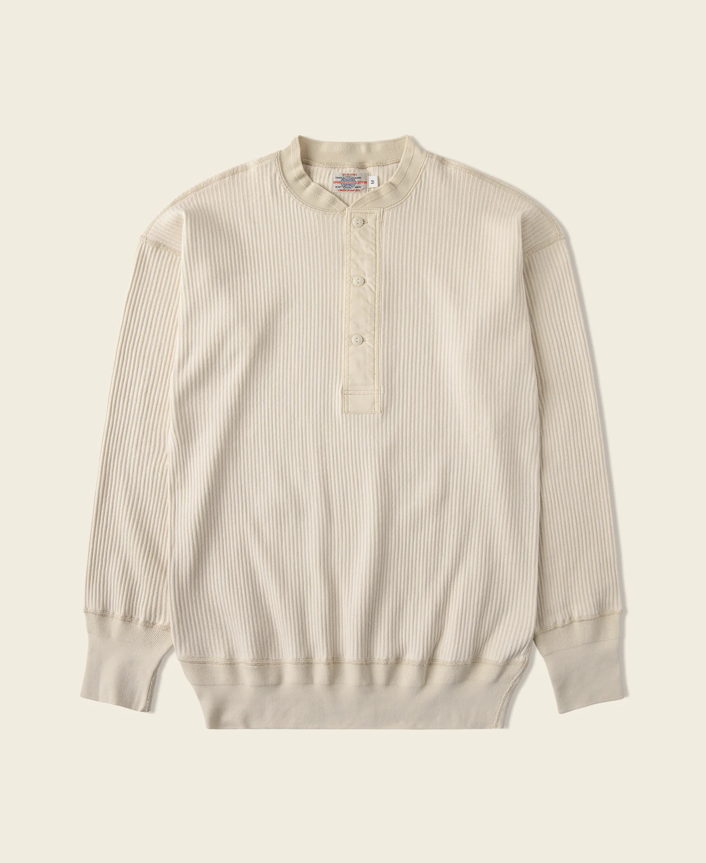 1943-ribbed-long-sleeve-henley-t-shirt-apricot-1.webp Ribbed Long Sleeve Henley T-Shirt - Apricot